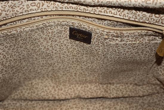 A Cartier Panthere textured brown leather shoulder bag, with signature gold-toned panther decoration to front